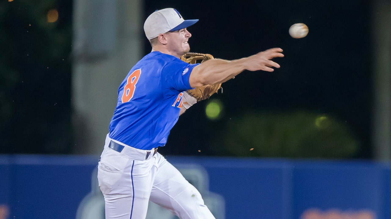 JJ Schwarz smacks grand slam, Florida blanks FSU to advance to College World Series